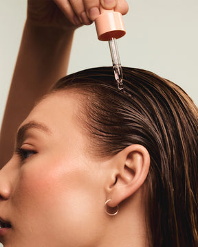 Model using Head & Hair Heal scalp  serum for itchy and dry scalp